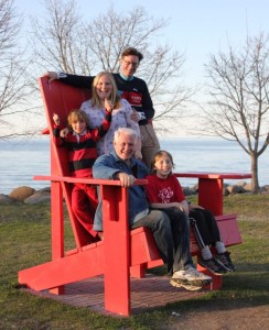 Meaford's Bodell family in one of Meaford's Big Red Chairs